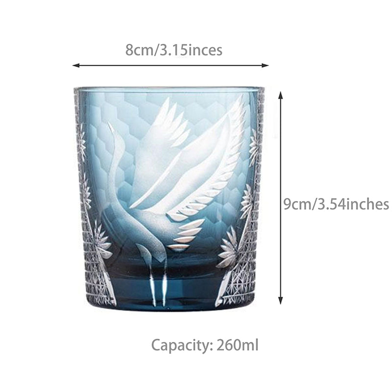 Glass tumbler with angel design and measurements on a white background