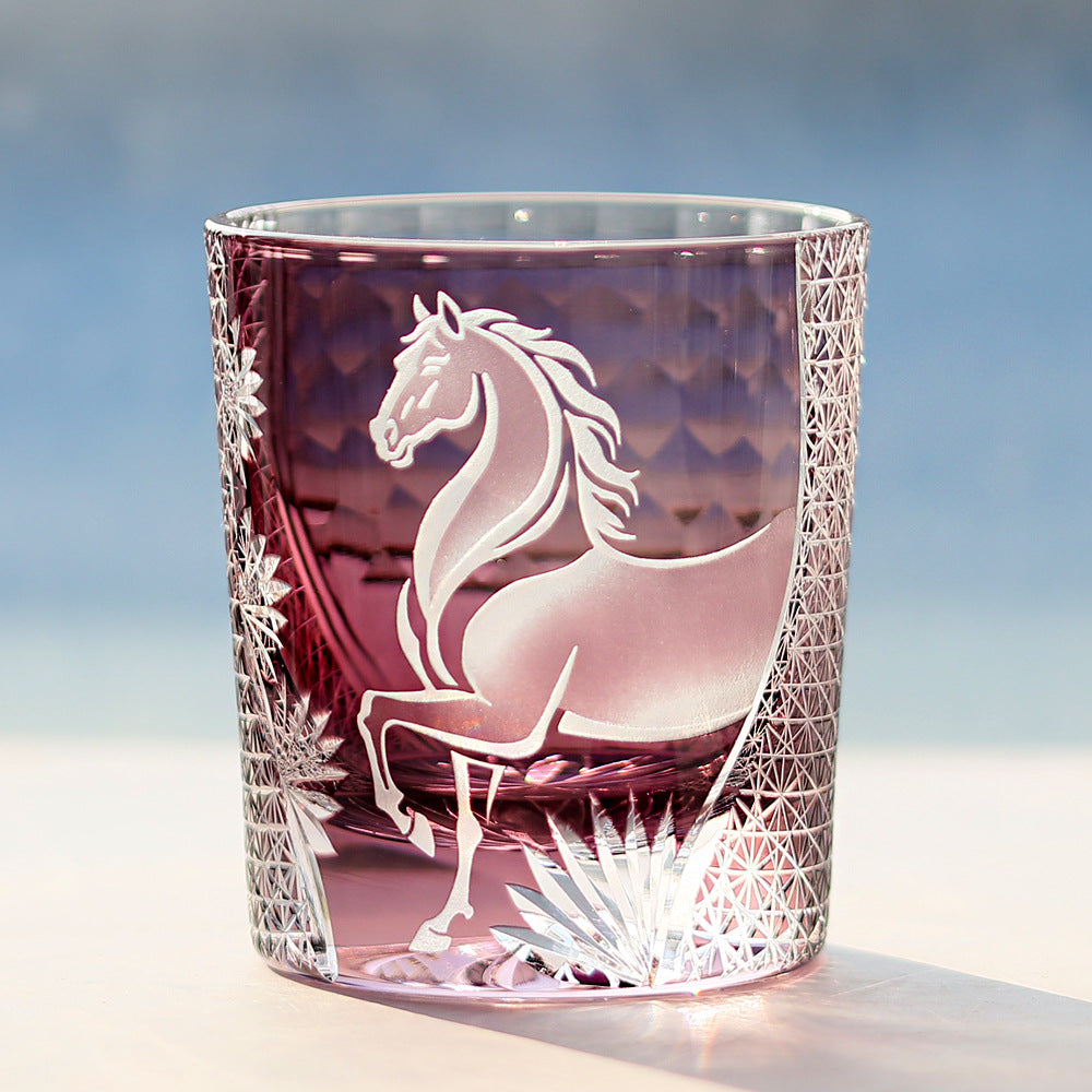 Glass tumbler with horse engraving on a gradient background