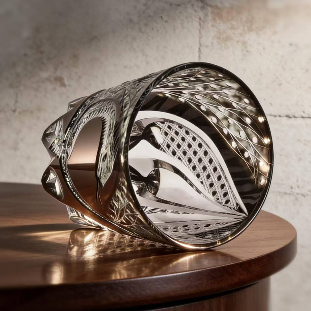 Decorative glass piece with intricate patterns on a wooden surface